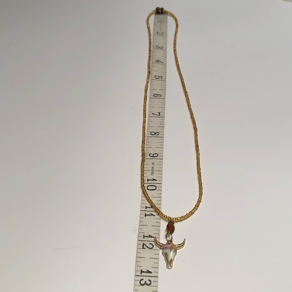 Handmade gold seed-bead, stretch necklace with boho cow skull pendant - Picture 5 of 6